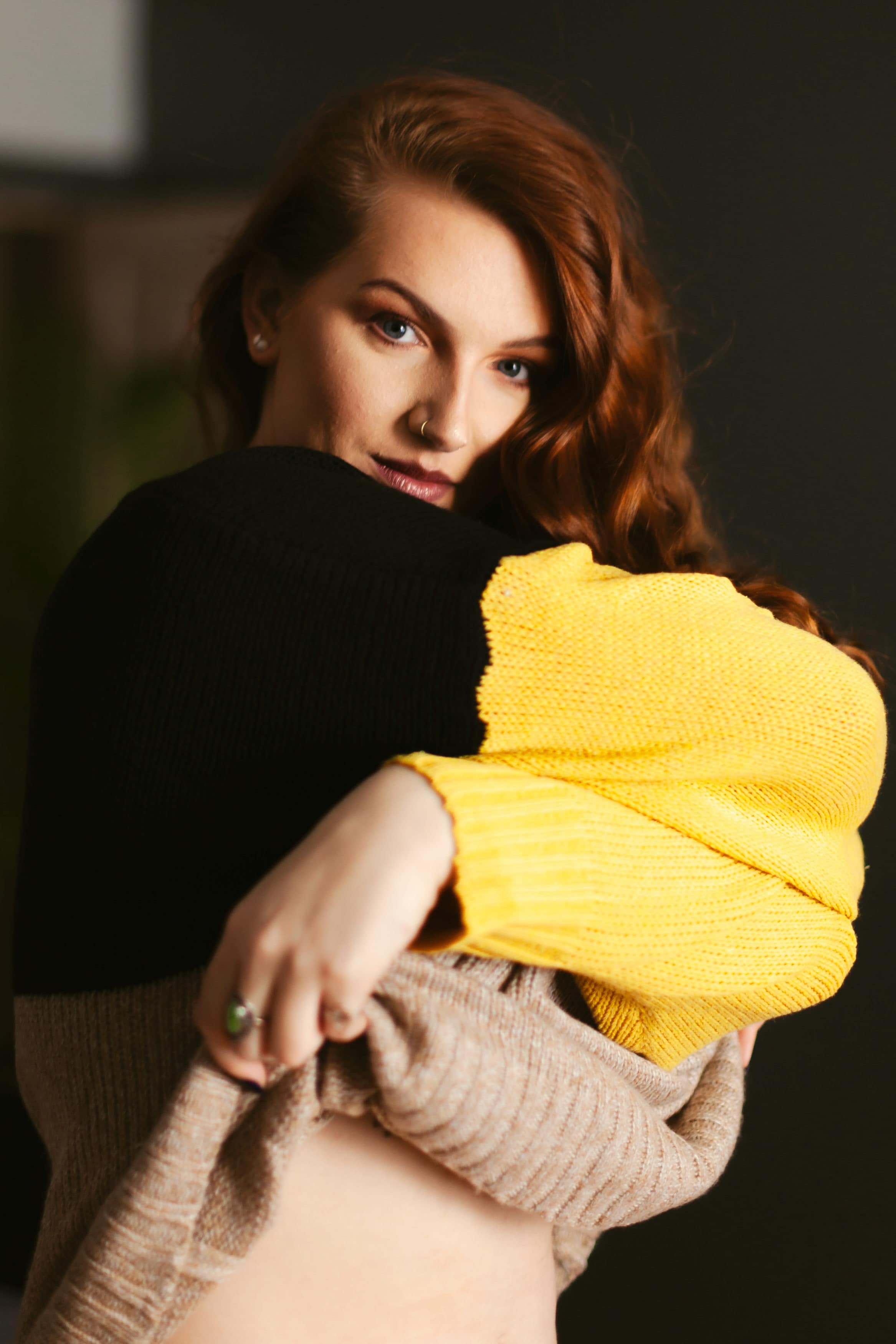 Woman taking off her sweater